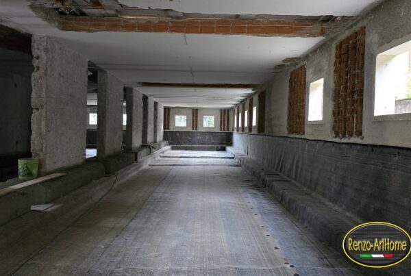 Interrato con telo bentonitico fissato alle pareti e steso sulla platea prima del getto